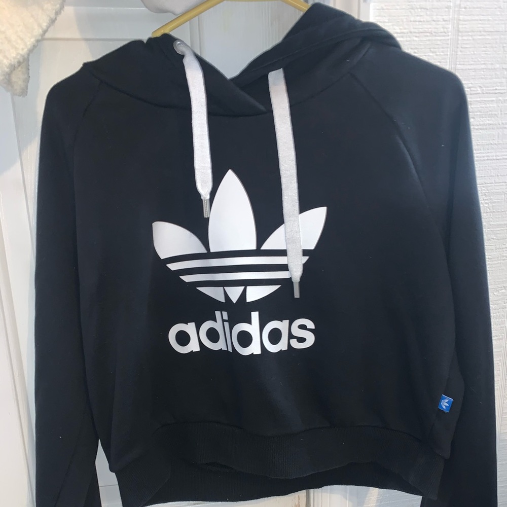 Woman's Adidas crop top hoodie.
